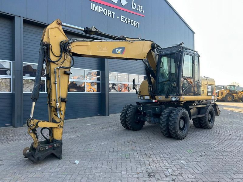 2011 Caterpillar M315D wheel excavator, side profile view