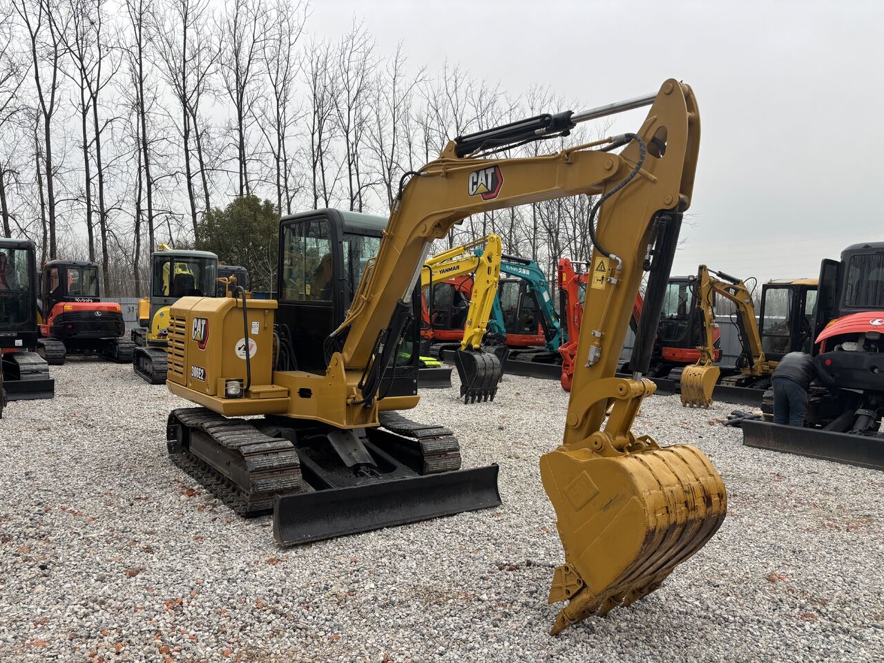 2023 Caterpillar 306E2 mini excavator, rear three-quarter view 2023 Caterpillar 306E2 mini excavator, rear three-quarter view