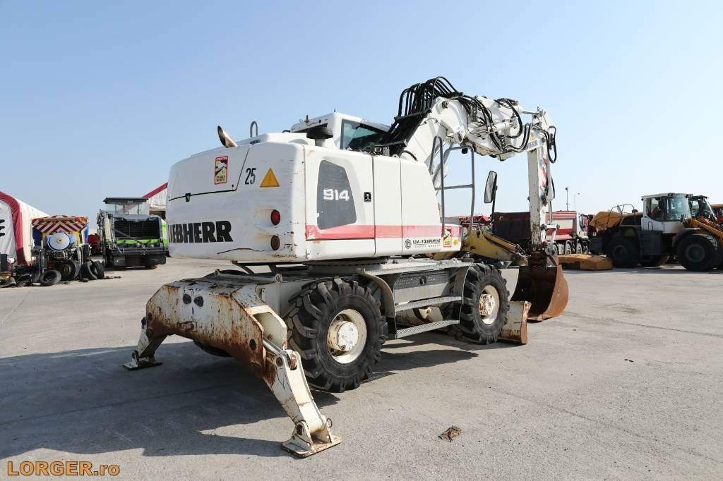2012 Liebherr A914 wheel excavator rear three-quarter view 2012 Liebherr A914 wheel excavator rear three-quarter view