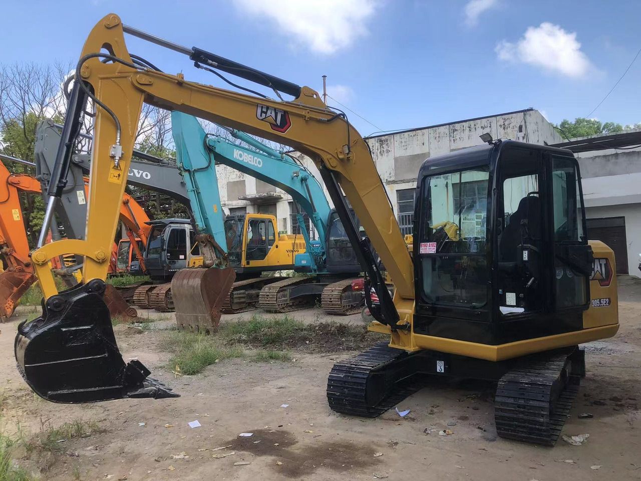 2011 Caterpillar 305.5E2 mini excavator, side view 2011 Caterpillar 305.5E2 mini excavator, side view