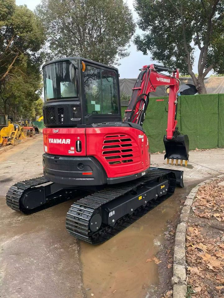2024 Yanmar VIO55-6B mini excavator, rear three-quarter view