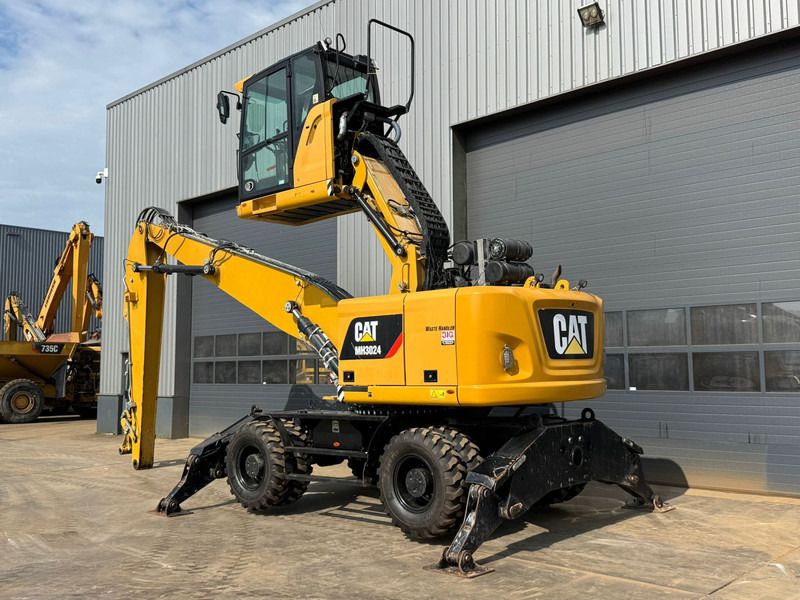 2019 Caterpillar MH3024 material handler, rear three-quarter view 2019 Caterpillar MH3024 material handler, rear three-quarter view