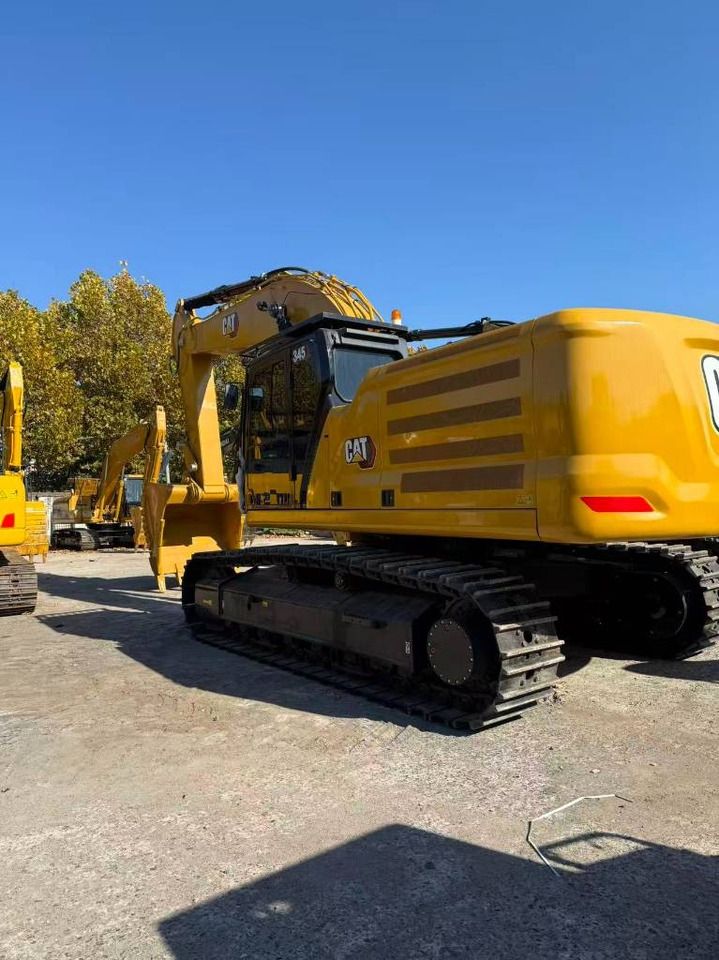 2025 Caterpillar 345 crawler excavator, rear three-quarter view