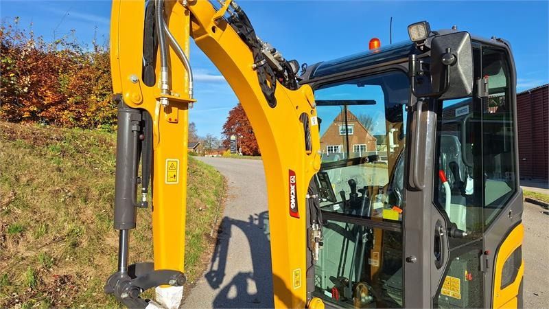 XCMG XE20E mini excavator, side view of cab and boom XCMG XE20E mini excavator, side view of cab and boom