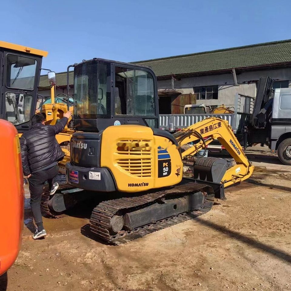 2016 Komatsu PC50MR-2 mini excavator, rear three-quarter view 2016 Komatsu PC50MR-2 mini excavator, rear three-quarter view