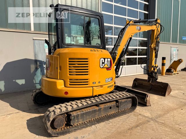 2021 Caterpillar 304E2 mini excavator, rear three-quarter view 2021 Caterpillar 304E2 mini excavator, rear three-quarter view