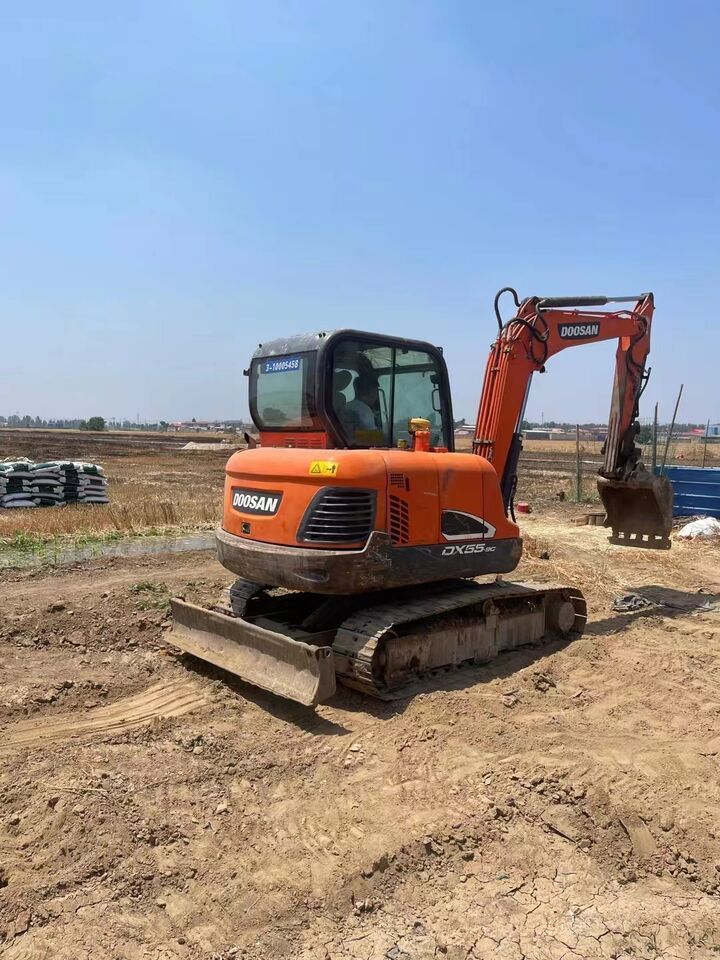 2023 Doosan DX55-9C mini excavator, rear three-quarter view 2023 Doosan DX55-9C mini excavator, rear three-quarter view