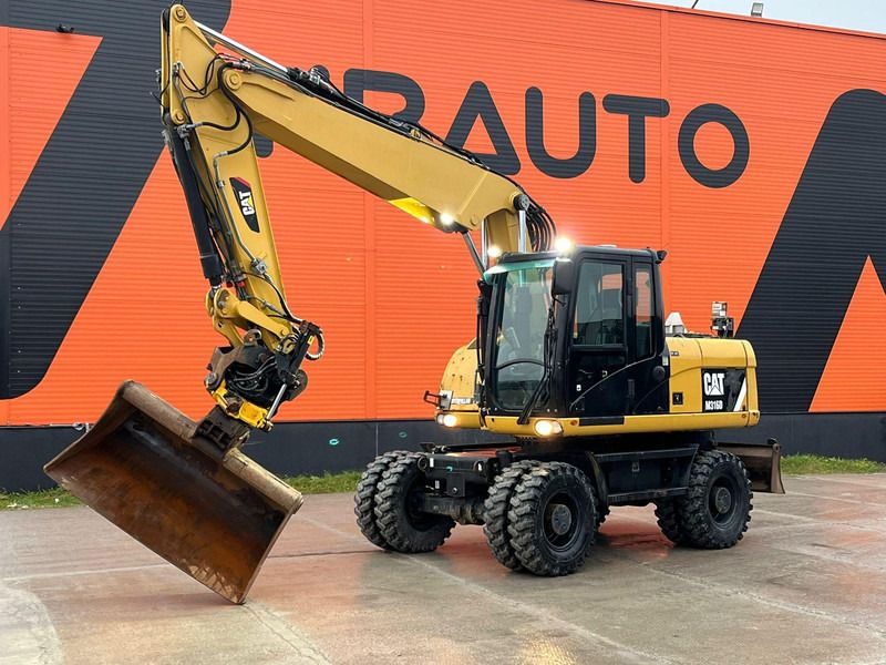 2011 Caterpillar M316D wheel excavator, side profile view 2011 Caterpillar M316D wheel excavator, side profile view