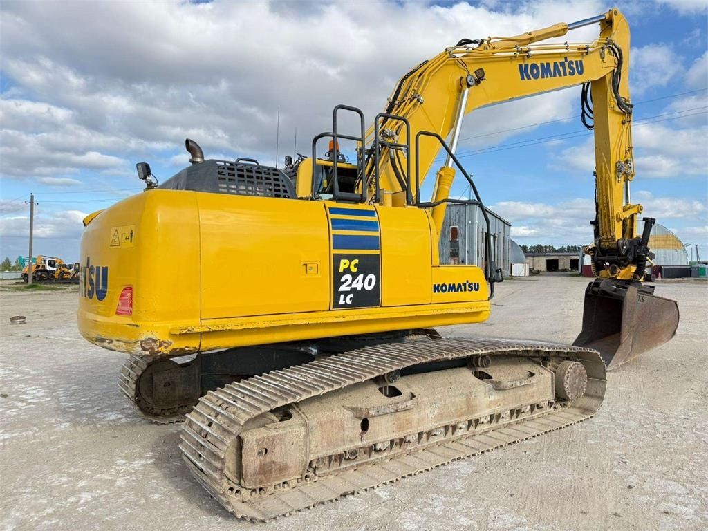 2012 Komatsu PC240LC-10 crawler excavator, rear three-quarter view 2012 Komatsu PC240LC-10 crawler excavator, rear three-quarter view