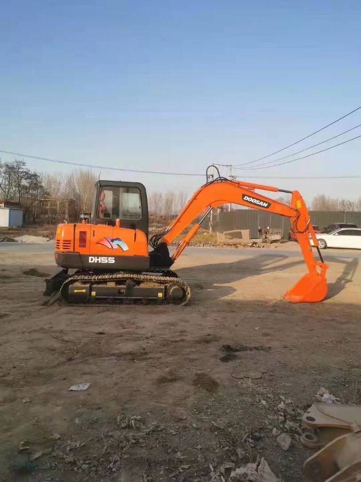 2023 Doosan DH55 mini excavator, side profile view