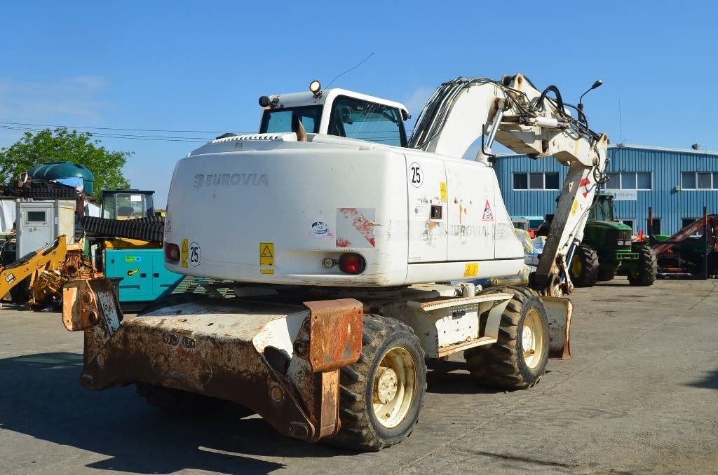 2008 CASE WX145 wheel excavator, rear three-quarter view 2008 CASE WX145 wheel excavator, rear three-quarter view