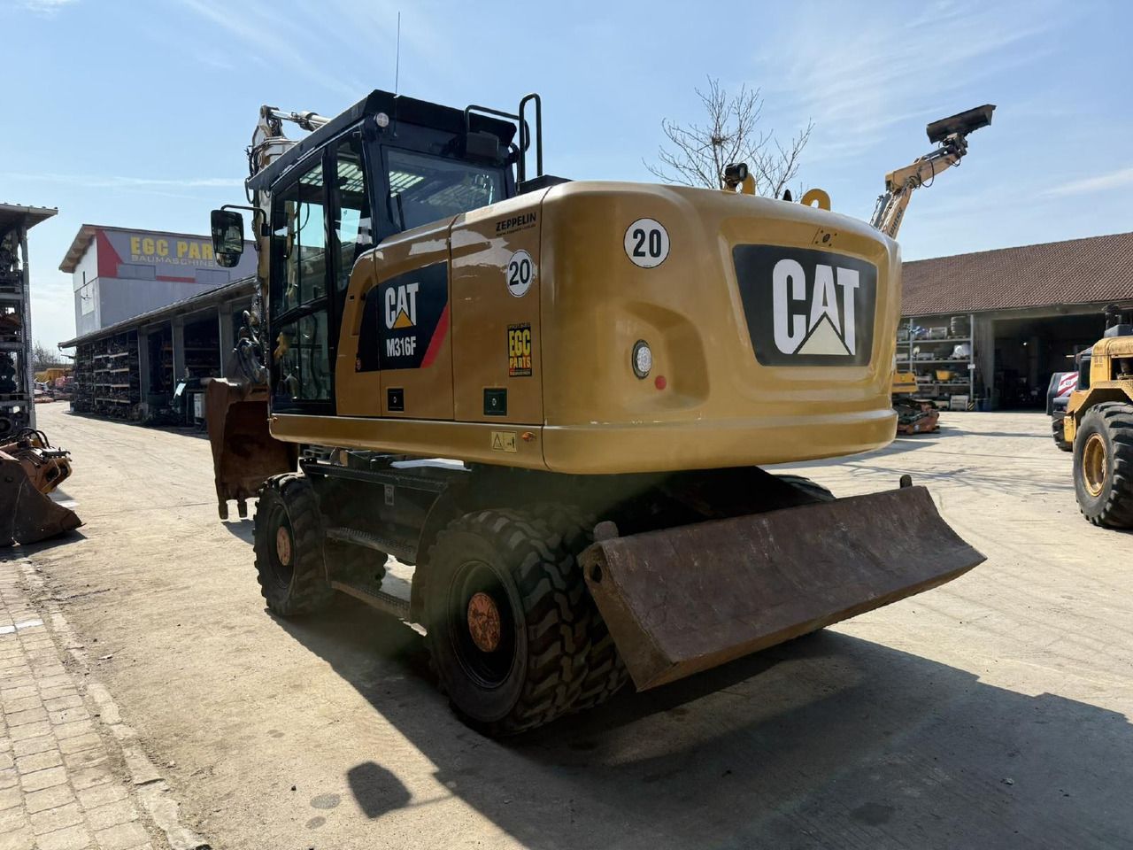 2016 Caterpillar M316F wheel excavator, rear three-quarter view