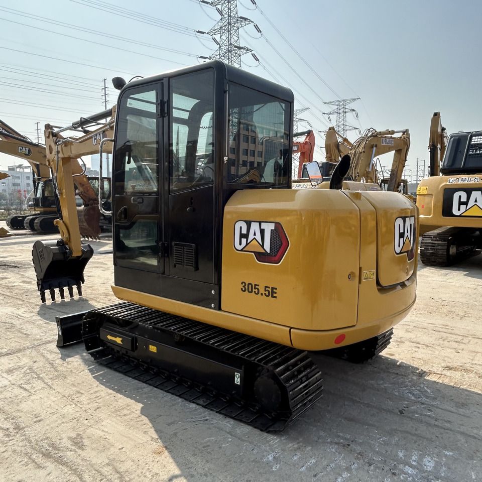 2023 Caterpillar 305.5E mini excavator, rear three-quarter view