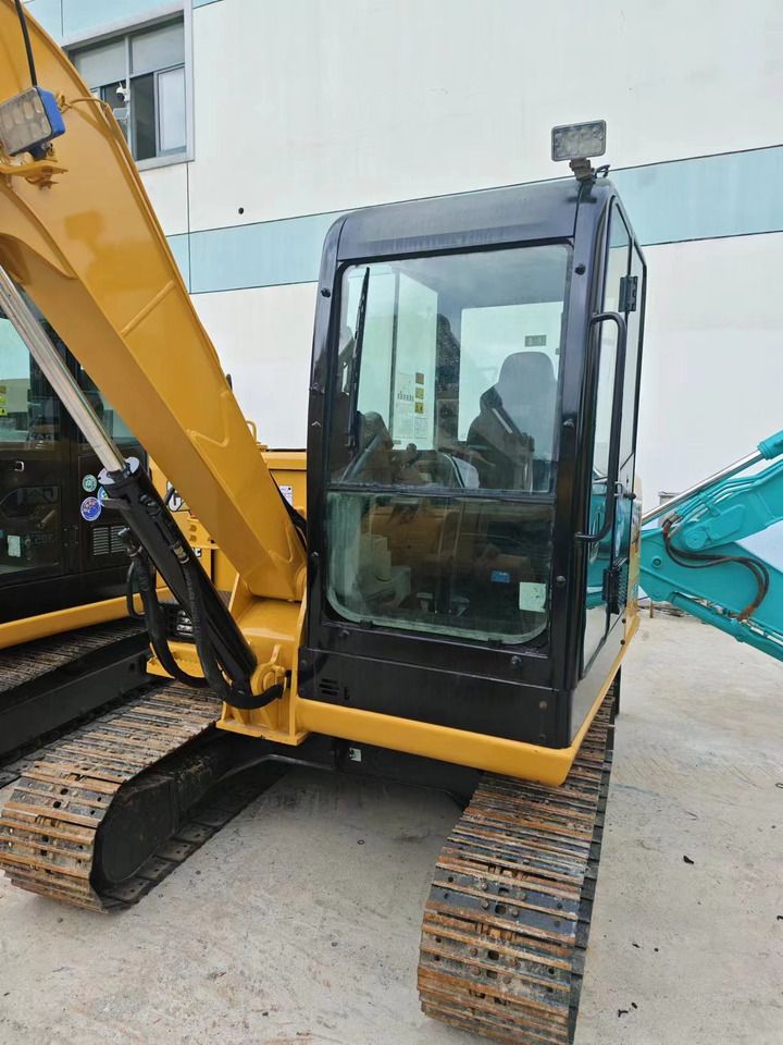 2022 Caterpillar 305.5E2 crawler excavator cab and boom view 2022 Caterpillar 305.5E2 crawler excavator cab and boom view