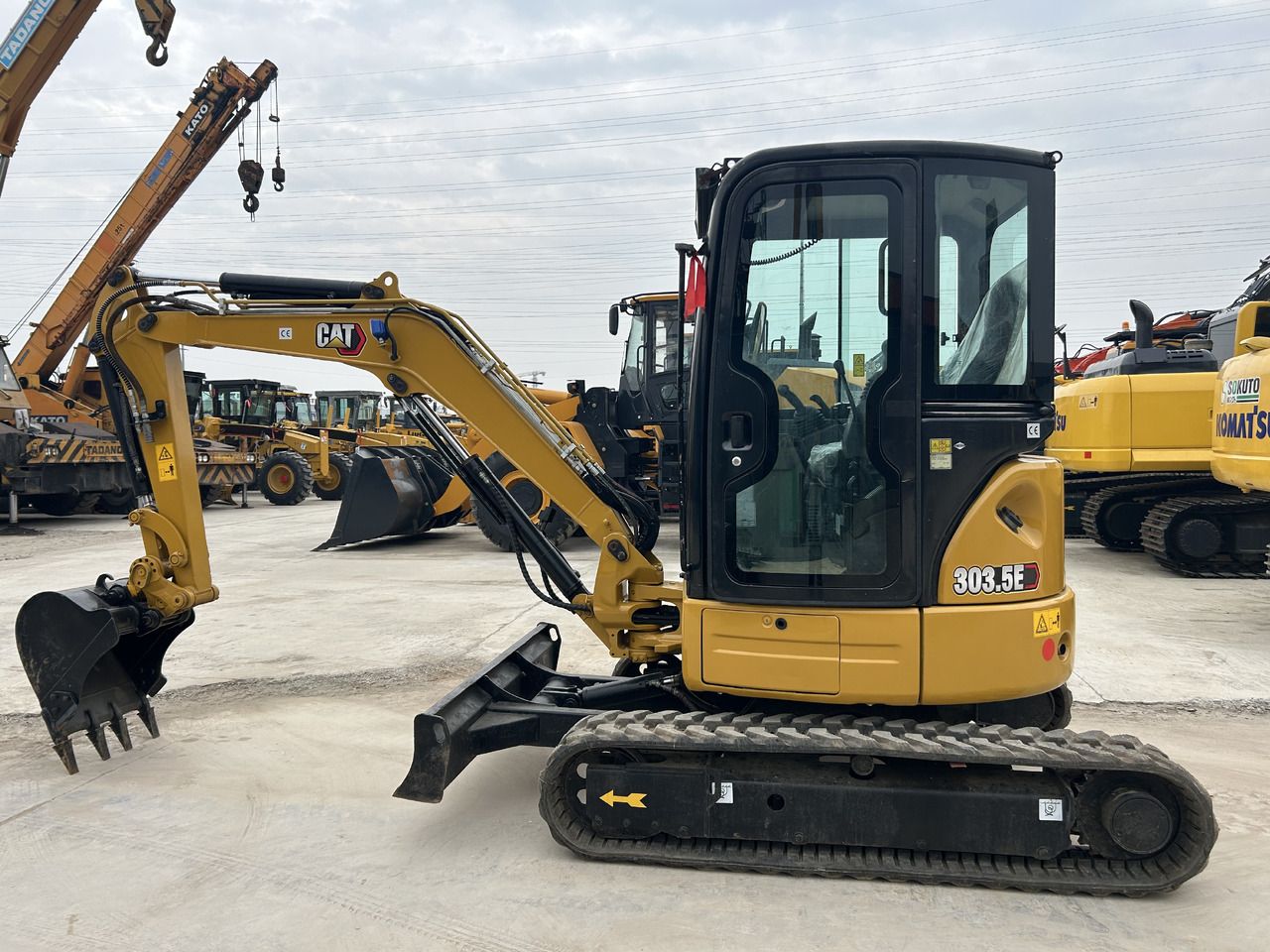 2024 Caterpillar 303.5E mini excavator, side profile view