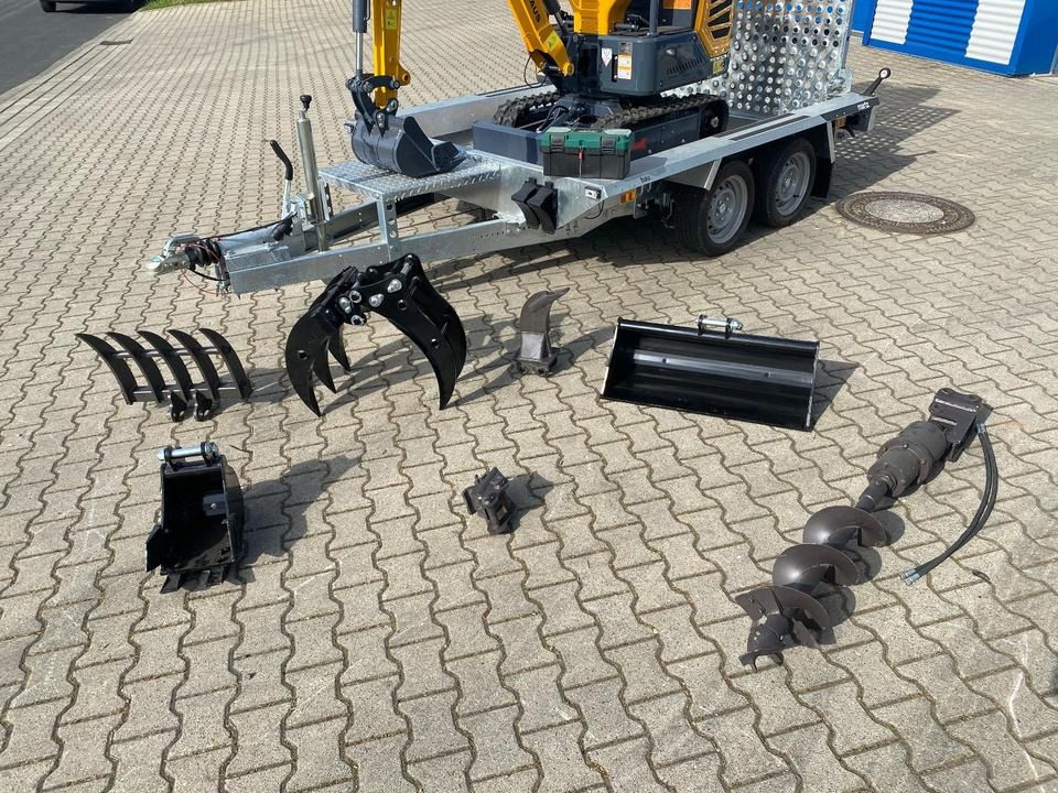 Berger Kraus BK1250JS mini excavator on trailer with attachments