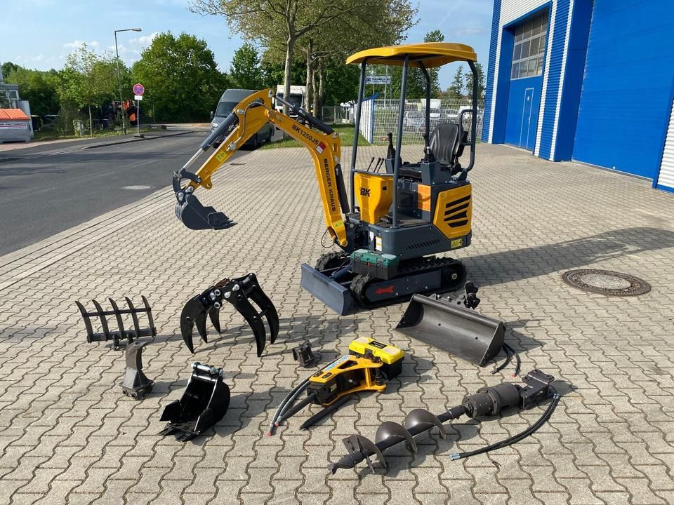 Berger Kraus BK1250JS mini excavator with attachments, side view Berger Kraus BK1250JS mini excavator with attachments, side view
