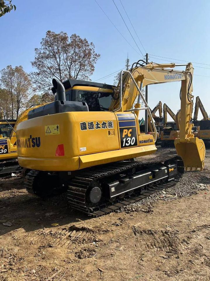 2023 Komatsu PC130-8 crawler excavator, rear three-quarter view 2023 Komatsu PC130-8 crawler excavator, rear three-quarter view