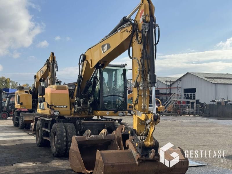2014 Caterpillar M313D wheel excavator, front three-quarter view 2014 Caterpillar M313D wheel excavator, front three-quarter view