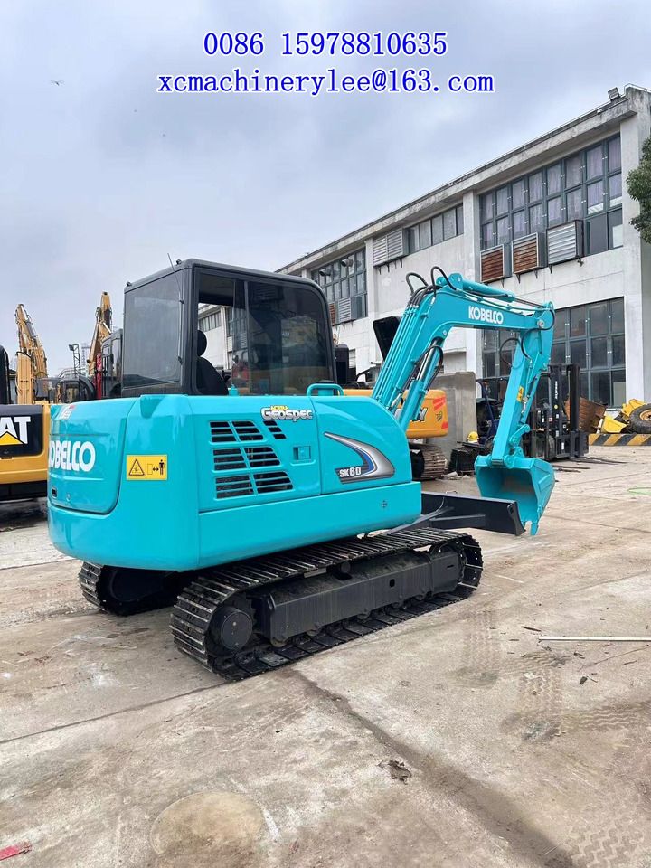 2024 Kobelco SK60 mini excavator, rear three-quarter view 2024 Kobelco SK60 mini excavator, rear three-quarter view