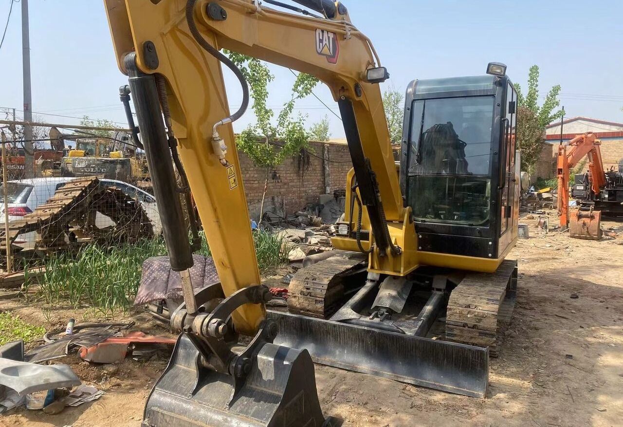 Caterpillar 306D mini excavator, front three-quarter view Caterpillar 306D mini excavator, front three-quarter view
