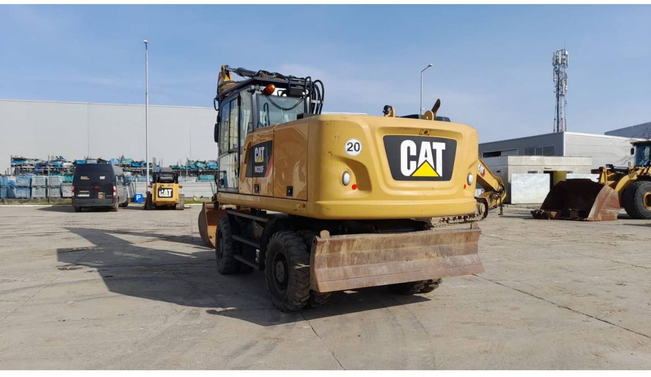 2016 Caterpillar M320F wheel excavator, rear three-quarter view 2016 Caterpillar M320F wheel excavator, rear three-quarter view