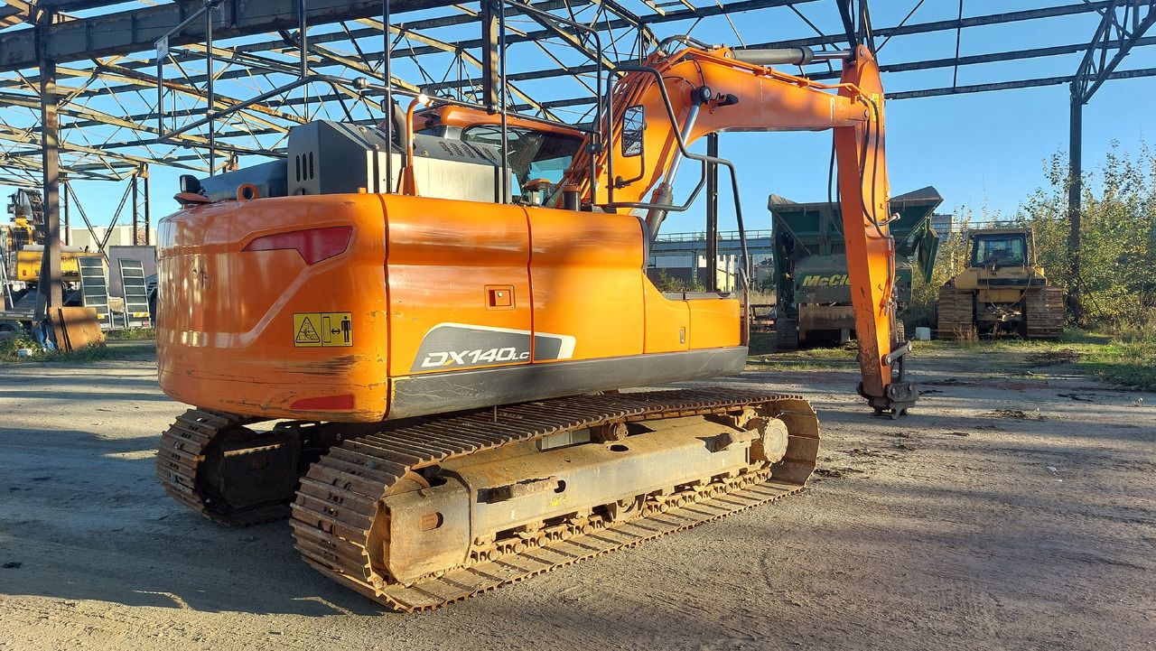 Doosan DX140LC-5 crawler excavator, rear three-quarter view