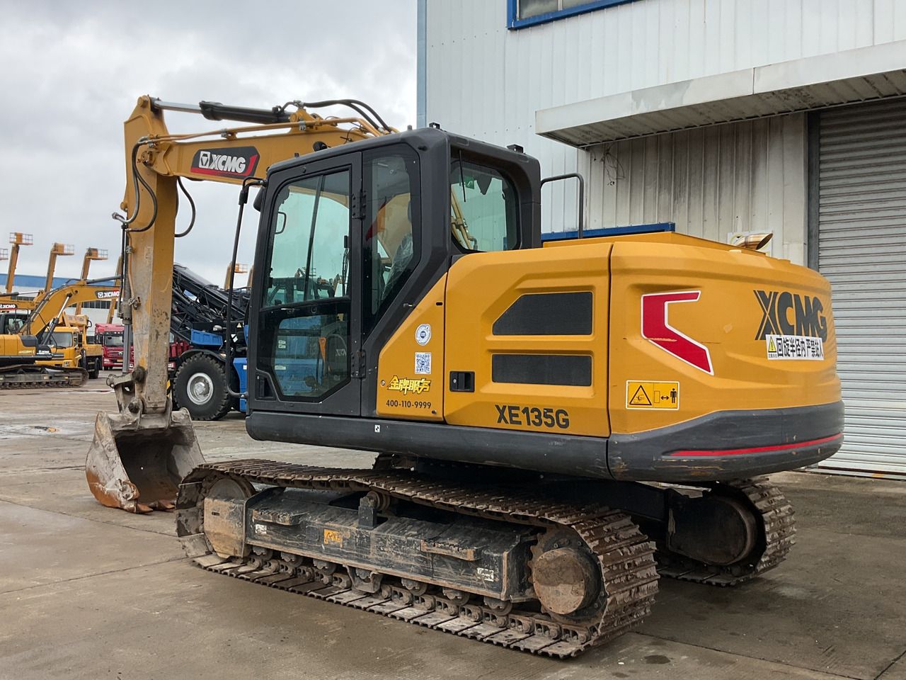 2024 XCMG XE135G crawler excavator, rear three-quarter view