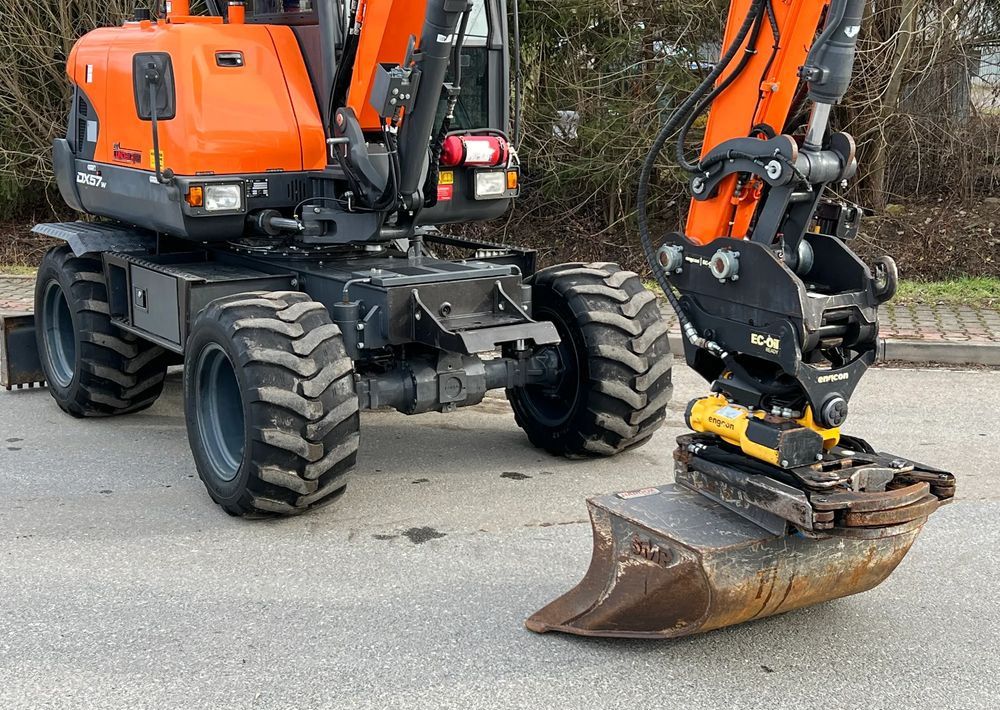 2017 Doosan DX57W wheel excavator, side view with attachment