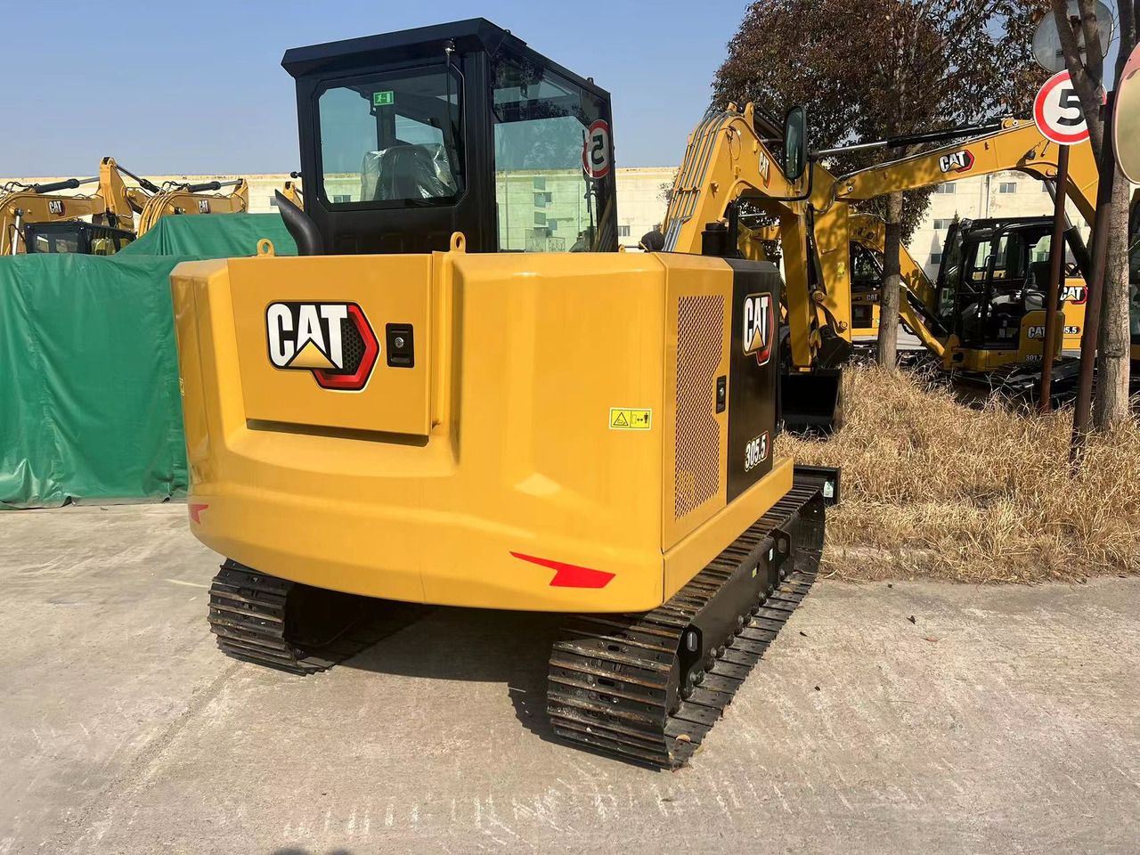 2026 Caterpillar 305.5 mini excavator, rear three-quarter view 2026 Caterpillar 305.5 mini excavator, rear three-quarter view