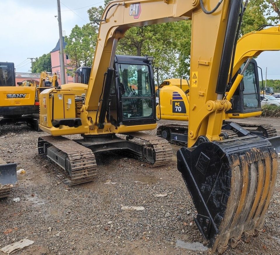 Caterpillar 307E mini excavator, front three-quarter view Caterpillar 307E mini excavator, front three-quarter view