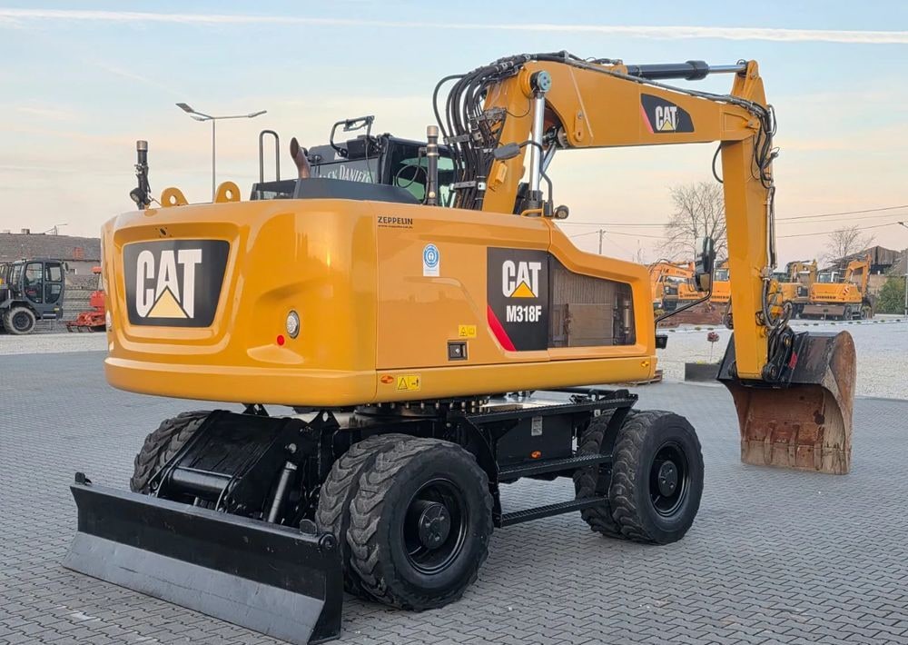 2019 Caterpillar M318F wheel excavator, rear three-quarter view