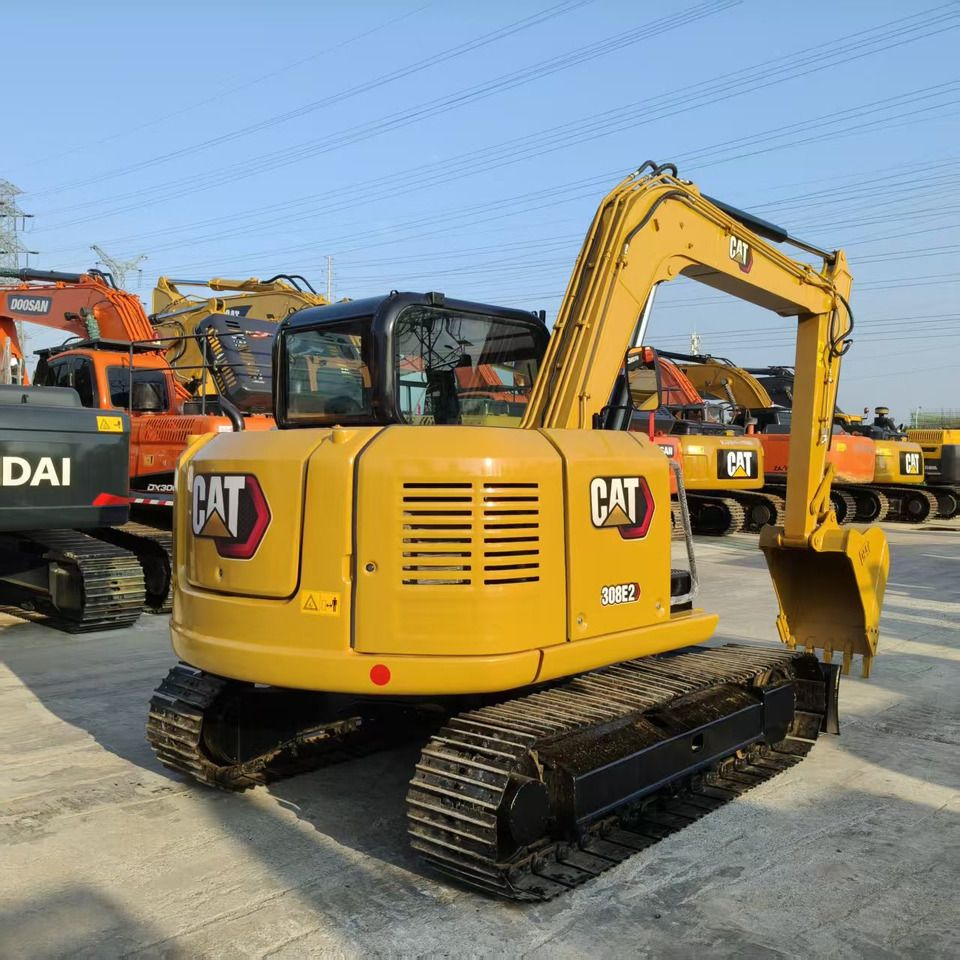 2024 Caterpillar 308E2 mini excavator, rear three-quarter view 2024 Caterpillar 308E2 mini excavator, rear three-quarter view