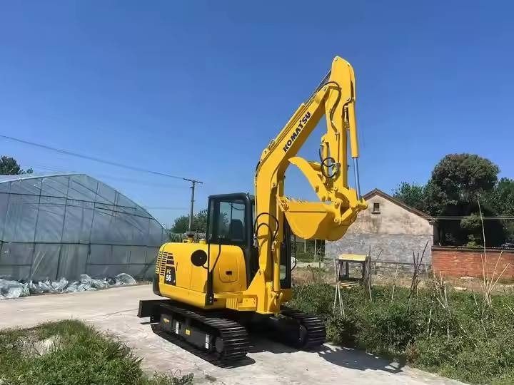 2024 Komatsu PC56-7 mini excavator, rear three-quarter view 2024 Komatsu PC56-7 mini excavator, rear three-quarter view