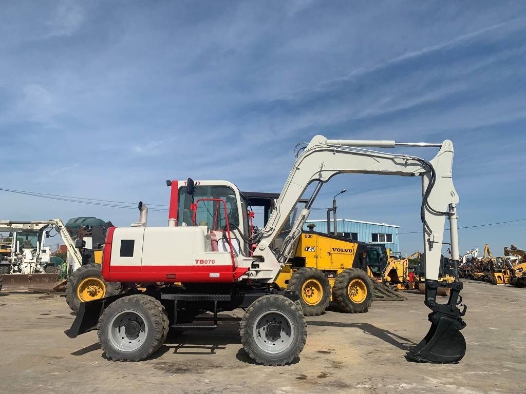 1997 Takeuchi TB070W wheel excavator side view