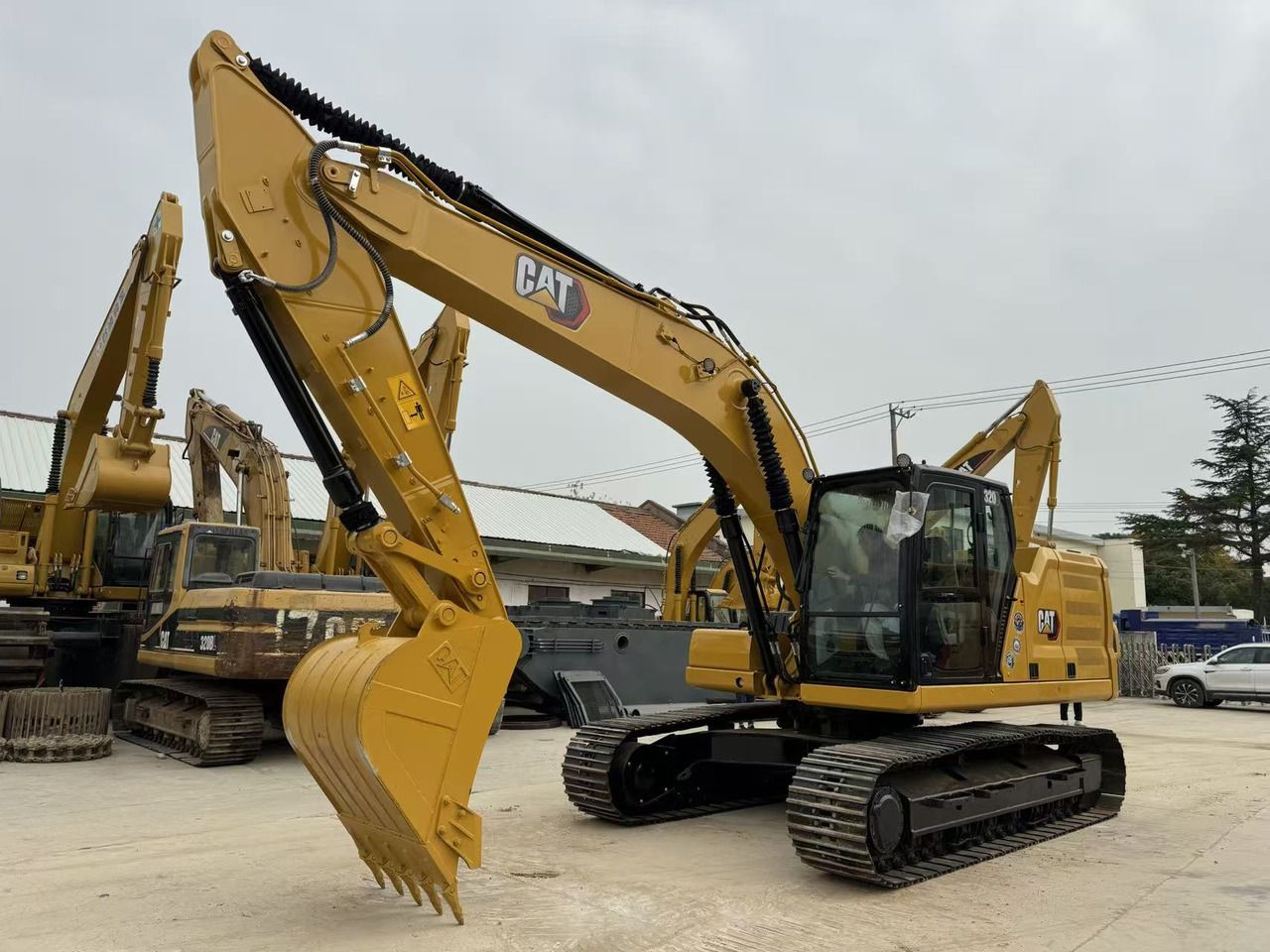 2024 Caterpillar 320 crawler excavator, side profile view 2024 Caterpillar 320 crawler excavator, side profile view