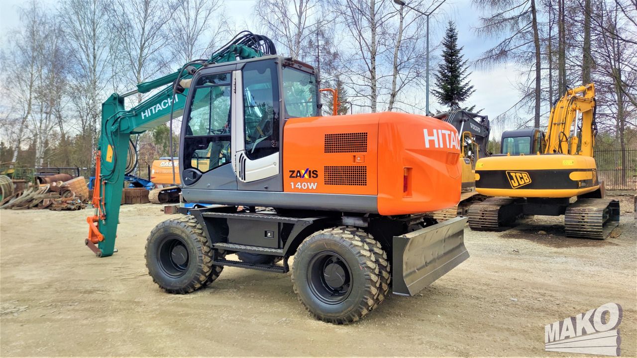 2012 Hitachi Zaxis 140W wheel excavator, side profile view 2012 Hitachi Zaxis 140W wheel excavator, side profile view