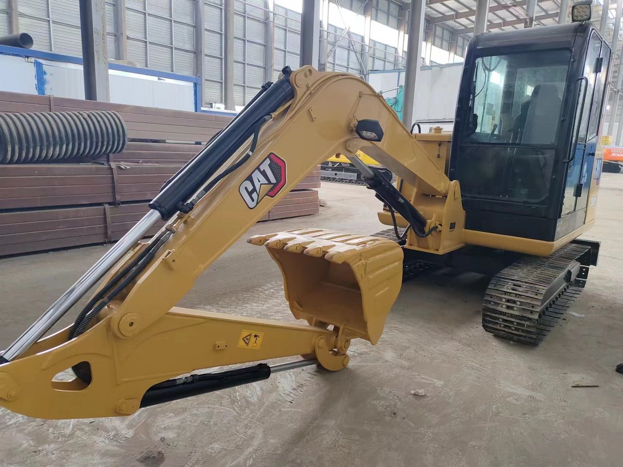 2022 Caterpillar 306E2 mini excavator, side view