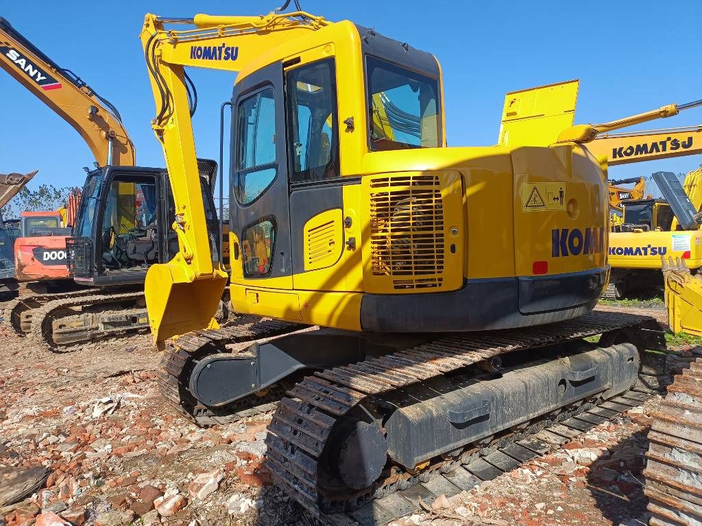 2023 Komatsu PC138US crawler excavator, rear three-quarter view