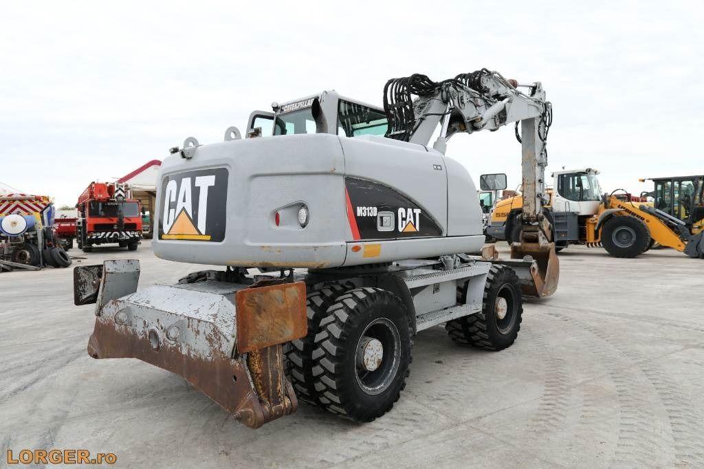 2009 Caterpillar M313D wheel excavator, rear three-quarter view 2009 Caterpillar M313D wheel excavator, rear three-quarter view