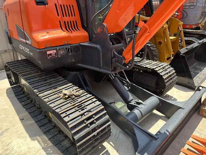 2022 Doosan DX55-9C mini excavator, side view 2022 Doosan DX55-9C mini excavator, side view