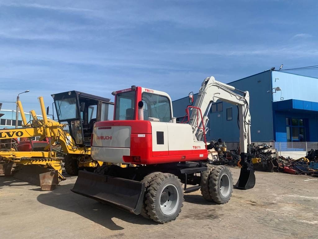 1997 Takeuchi TB070W wheel excavator, rear three-quarter view