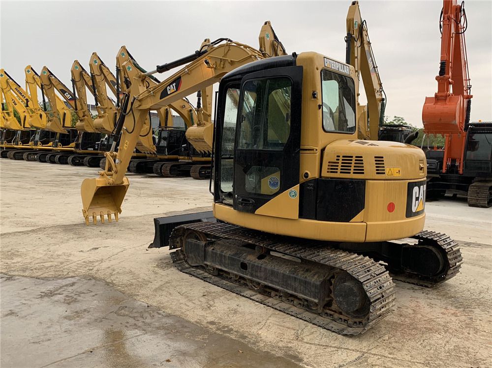 Mitsubishi 308D crawler excavator, rear three-quarter view Mitsubishi 308D crawler excavator, rear three-quarter view