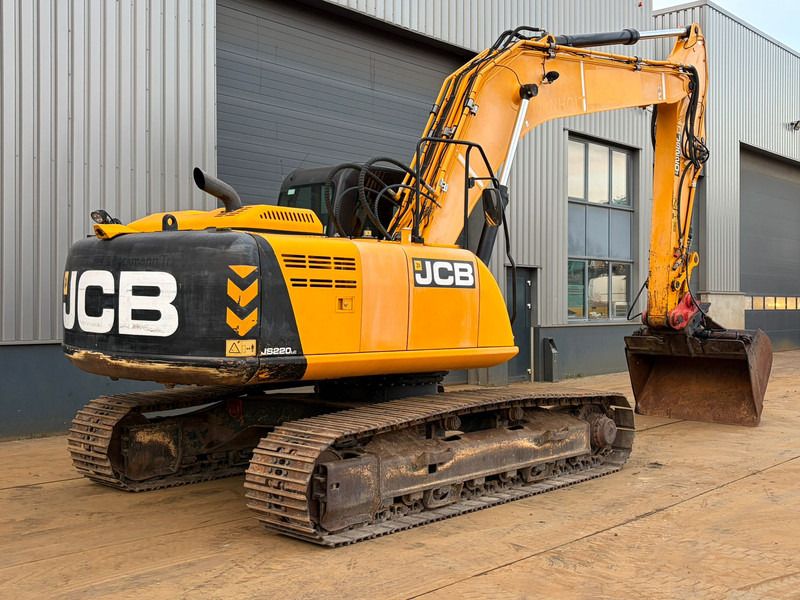2015 JCB JS220 crawler excavator, rear three-quarter view 2015 JCB JS220 crawler excavator, rear three-quarter view