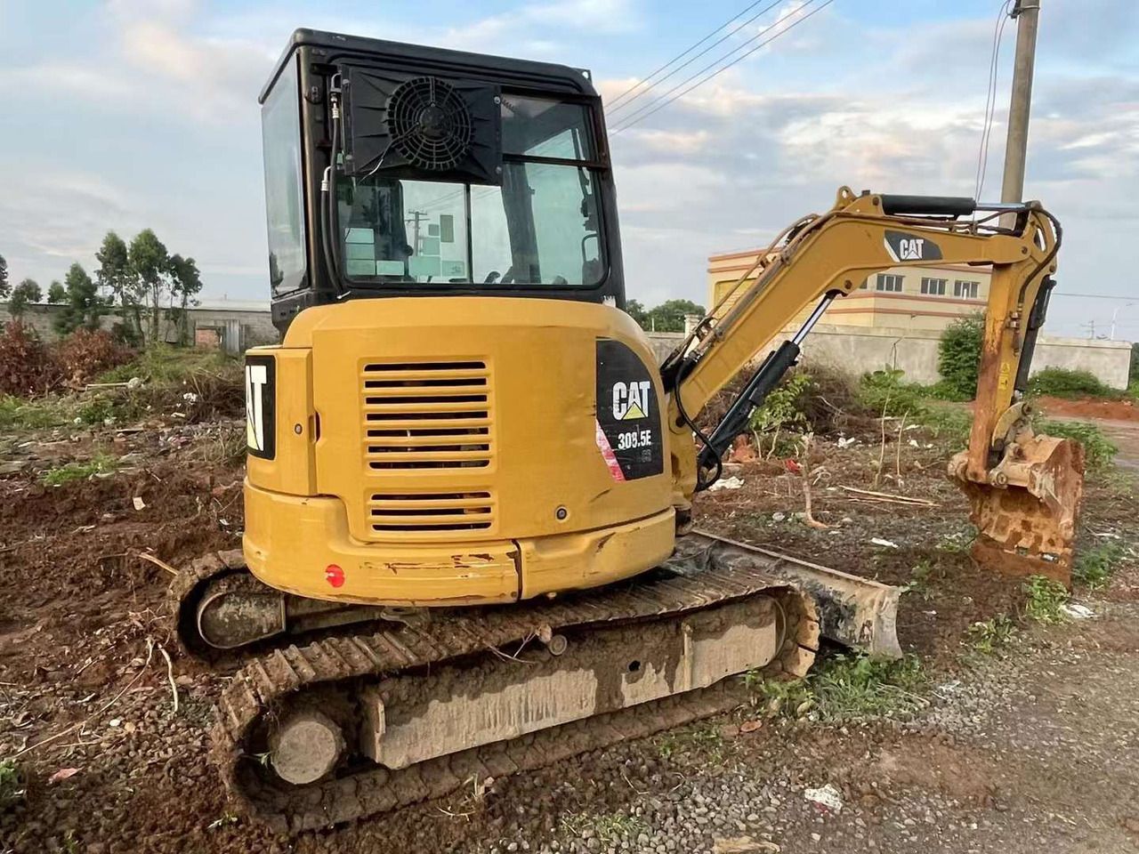 2019 Caterpillar 303.5E mini excavator, rear three-quarter view