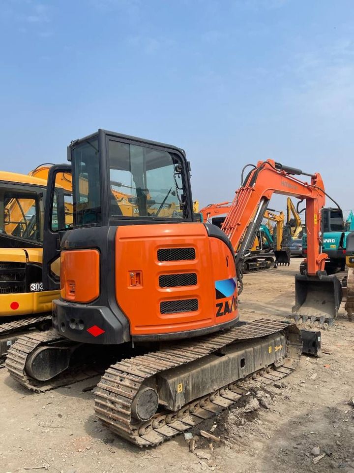 2025 Hitachi ZX55 mini excavator, rear three-quarter view 2025 Hitachi ZX55 mini excavator, rear three-quarter view
