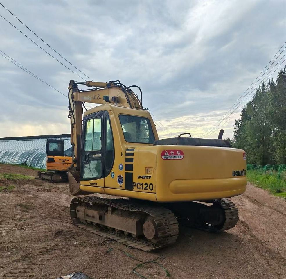 2015 Komatsu PC120-6 crawler excavator, rear three-quarter view 2015 Komatsu PC120-6 crawler excavator, rear three-quarter view