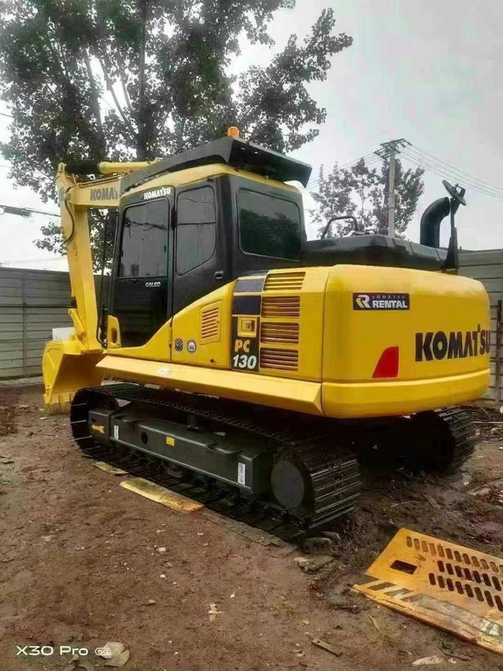 2022 Komatsu PC130-7 crawler excavator, rear three-quarter view 2022 Komatsu PC130-7 crawler excavator, rear three-quarter view