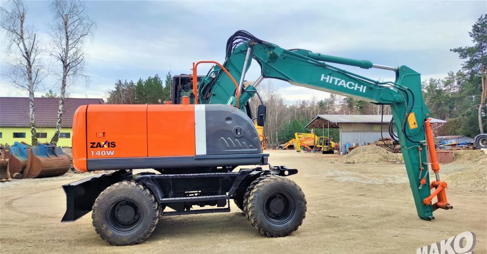 2012 Hitachi Zaxis 140W wheel excavator, side view