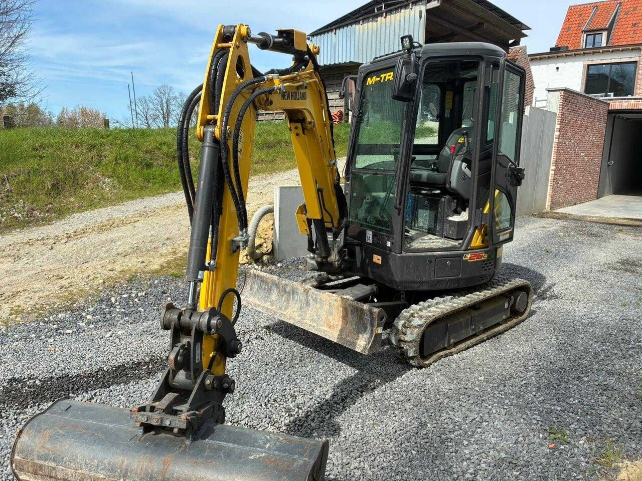2021 New Holland E26C mini excavator, front three-quarter view